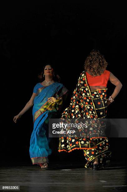 Bangladeshi eunuchs, castrated male, locally named "Hijra" display an outfit during a fashion show in Dhaka on August 18, 2009. A Bangladeshi...