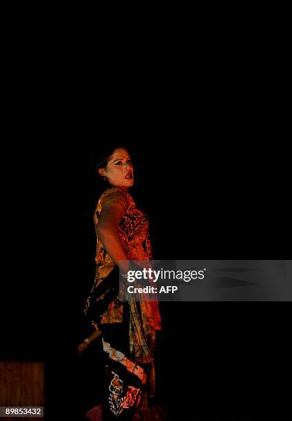 Bangladeshi eunuch, castrated male, locally named "Hijra" displays an outfit during a fashion show in Dhaka on August 18, 2009. A Bangladeshi...