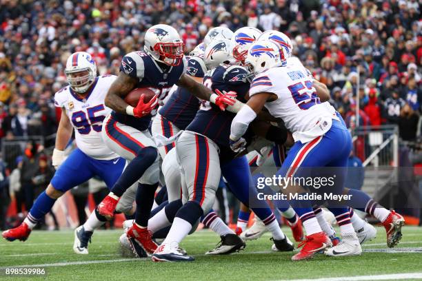 Mike Gillislee of the New England Patriots scores a touchdown against the Buffalo Bills at Gillette Stadium on December 24, 2017 in Foxboro,...