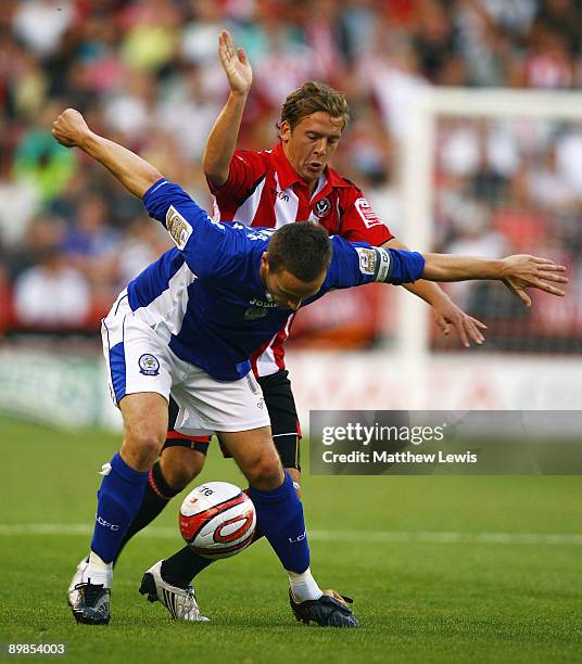 Matt Oakley of Leicester holds off Brian Howard of Sheffield during the Coca-Cola Championship match between Sheffield United and Leicester City at...