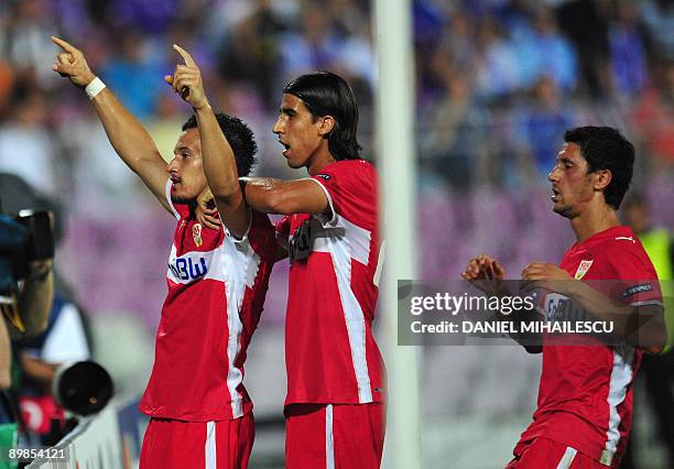 VfB Stuttgart's Timo Gebhart celebrates after he scored 1-0 against FC Timisoara's togheter with teammates Sami Khedira and Ciprian Marica during...