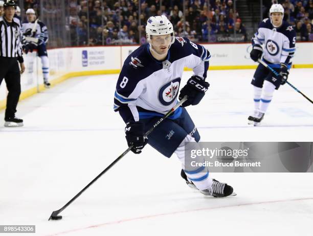 Jacob Trouba of the Winnipeg Jets skates against the New York Islanders at the Barclays Center on December 23, 2017 in the Brooklyn borough of New...