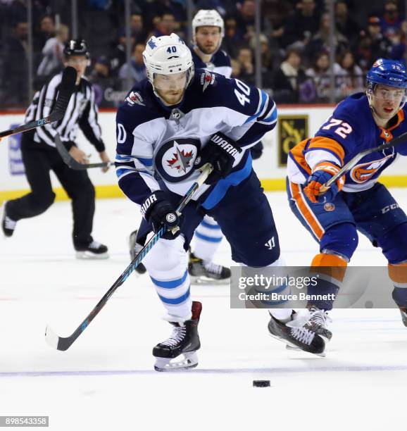 Joel Armia of the Winnipeg Jets skates against the New York Islanders at the Barclays Center on December 23, 2017 in the Brooklyn borough of New York...