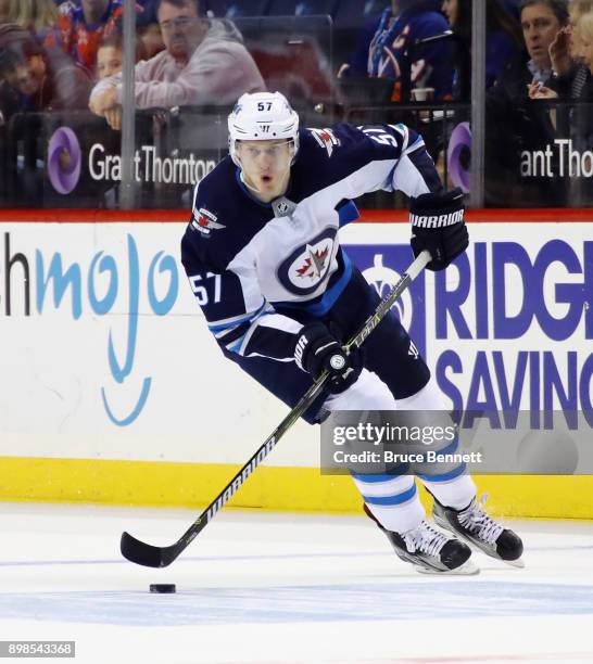 Tyler Myers of the Winnipeg Jets skates against the New York Islanders at the Barclays Center on December 23, 2017 in the Brooklyn borough of New...