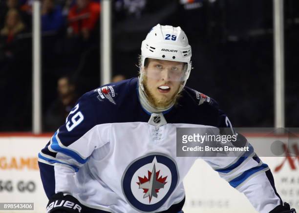 Patrik Laine of the Winnipeg Jets skates against the New York Islanders at the Barclays Center on December 23, 2017 in the Brooklyn borough of New...