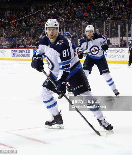 Kyle Connor of the Winnipeg Jets skates against the New York Islanders at the Barclays Center on December 23, 2017 in the Brooklyn borough of New...