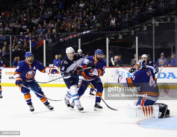 Jacob Trouba of the Winnipeg Jets skates against the New York Islanders at the Barclays Center on December 23, 2017 in the Brooklyn borough of New...