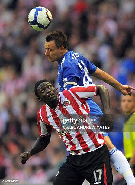 Chelsea's English defender John Terry clears from Sunderland's Trinidadian forward Kenwyne Jones during the English Premier League football match at...