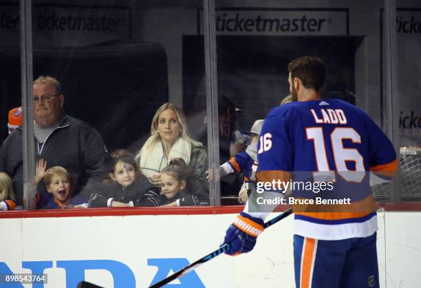 New York Islanders players skate in warmups past players children prior to the game against the Winnipeg Jets at the Barclays Center on December 23,...