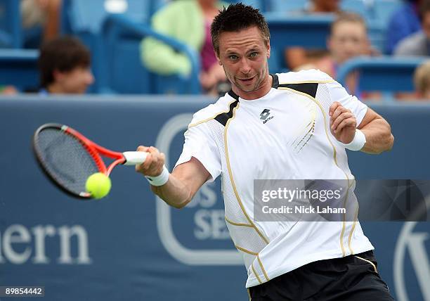 Robin Soderling of Sweden hits a forehand against Lleyton Hewitt of Australia during day two of the Western & Southern Financial Group Masters on...