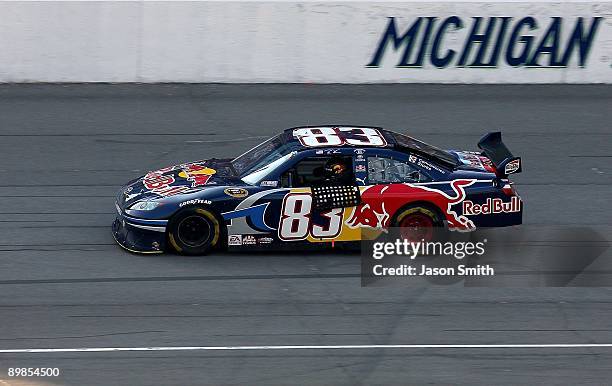 Brian Vickers, driver of the Red Bull Toyota, celebrates winning the NASCAR Sprint Cup Series CARFAX 400 at Michigan International Speedway on August...