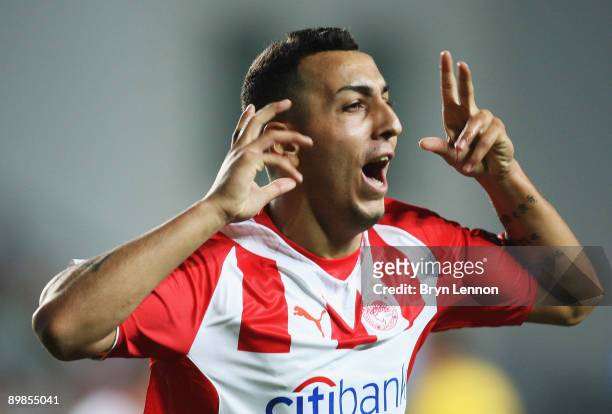 Kostas Mitroglou of Olympicaos FC celebrates scoring during the UEFA Champions League qualifying match between FC Sheriff and Olympiacos FC on August...