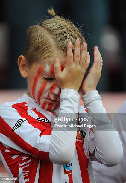 Young Sunderland fan looks dejected during the Barclays Premier League match between Sunderland and Chelsea at the Stadium of Light on August 18,...