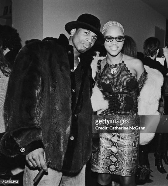 Rapper Eve poses for a photo with an unidentified friend at a party for Harpers Bazaar magazine in 2000 in New York City, New York