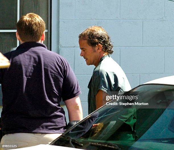 Mark McLeod of Appling, Ga. Is escorted to a court hearing at the Tybee Island Municipal Court on August 18, 2009 in Tybee Island, Georgia. McLeod...