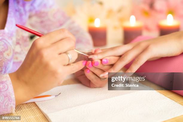 manicure process in beauty salon - long form stock pictures, royalty-free photos & images