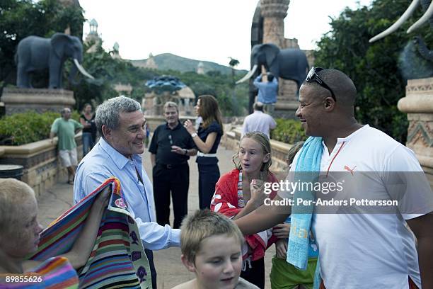 Sol Kerzner, the South African hotel magnate, is greeted tourists while walking around the Palace Hotel on March 31, 2009 in Sun City, South Africa....