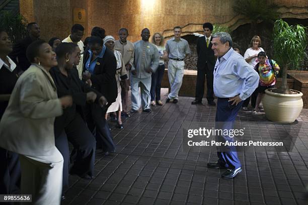 Sol Kerzner, the South African hotel magnate, is greeted by singing and dancing after arriving at the Palace Hotel on March 31, 2009 in Sun City,...