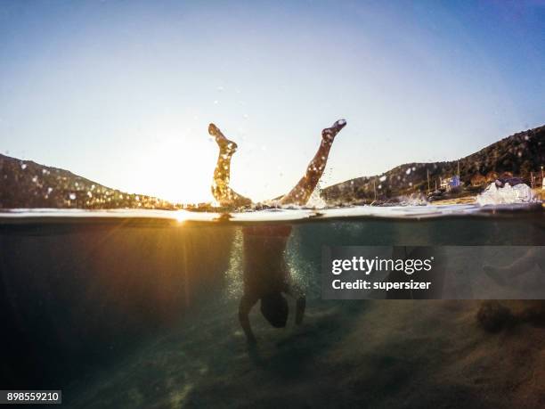 kid swimming in the sea - water glide stock pictures, royalty-free photos & images