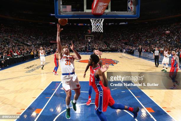 Ron Baker of the New York Knicks goes to the basket against the Philadelphia 76ers on December 25, 2017 at Madison Square Garden in New York City,...