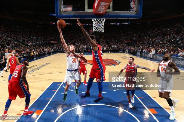 Ron Baker of the New York Knicks goes to the basket against the Philadelphia 76ers on December 25, 2017 at Madison Square Garden in New York City,...