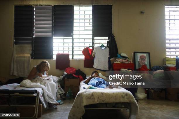 Lidia Sellas and her daughter Sheila Martinez , who is blind, rest in the shelter for Hurricane Maria victims where they currently reside, on...