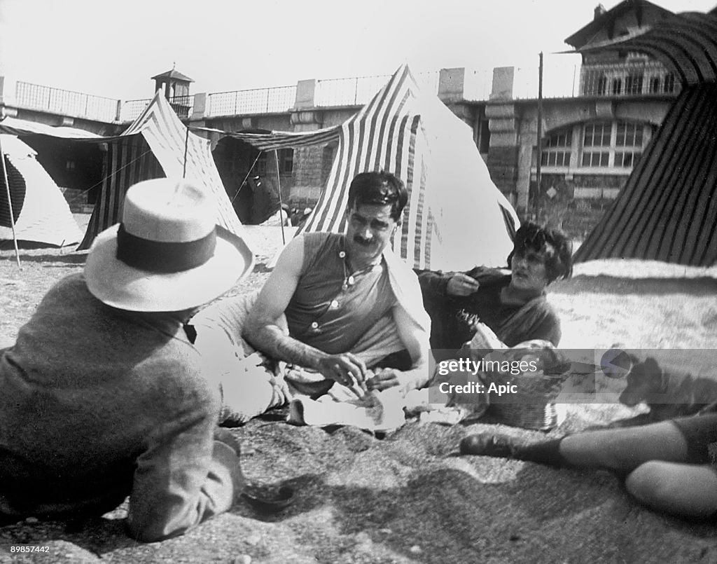 Coco Chanel and her lover Arthur " Boy " Capel (mustache) with Constent Say on the beach in Saint Jean de Luz in 1917