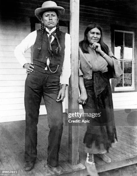 Quanah Parker leader of Comanche indians with his wife Tonasa outside their house in 1892
