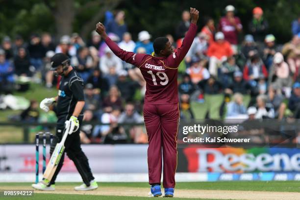 Sheldon Cottrell of the West Indies celebrates after dismissing Neil Broom of New Zealand during the One Day International match during the series...