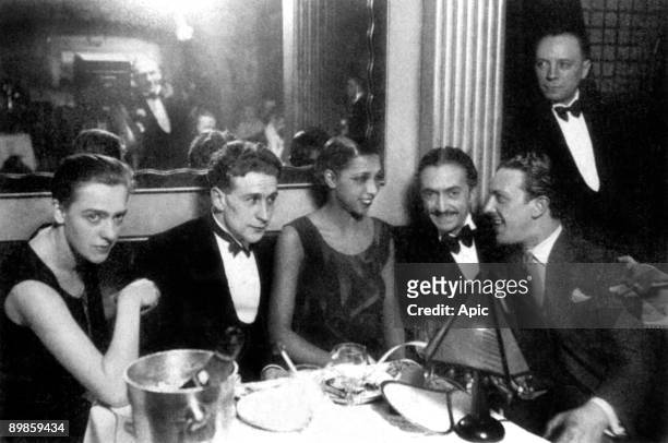 Josephine Baker with writer Georges Simenon and his wife Tigy and her fiancee and agent Guiseppe Abatino called Pepito around 1928 on her restaurant...