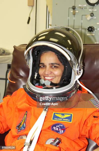 Mission Specialist Kalpana Chawla is helped suiting up for Terminal Countdown Demonstration Test activities, which include a simulated launch...