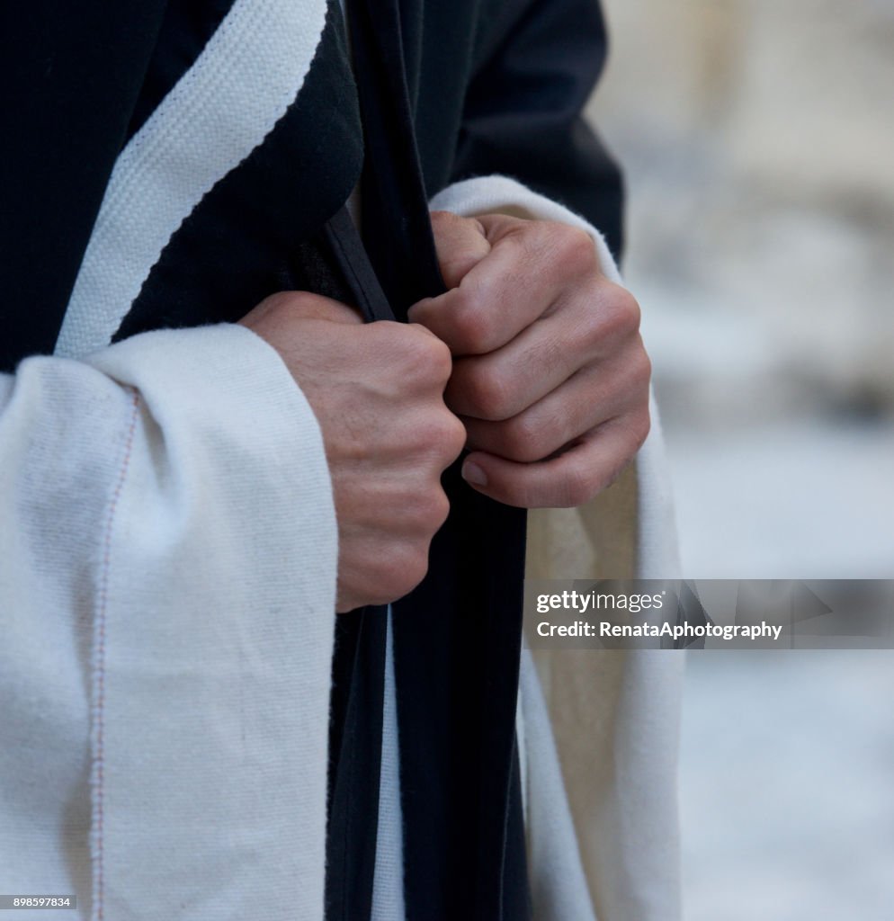 Close up of a Catholic priests hands