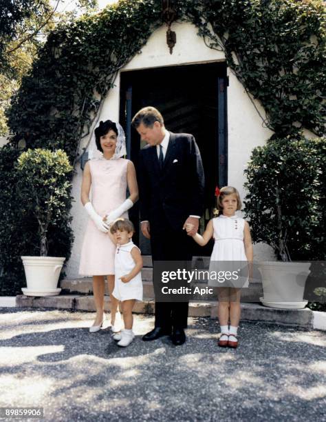 President John Kennedy and his wife Jackie and their children John Jr and Caroline at Palm Beach, Florida april 14, 1963