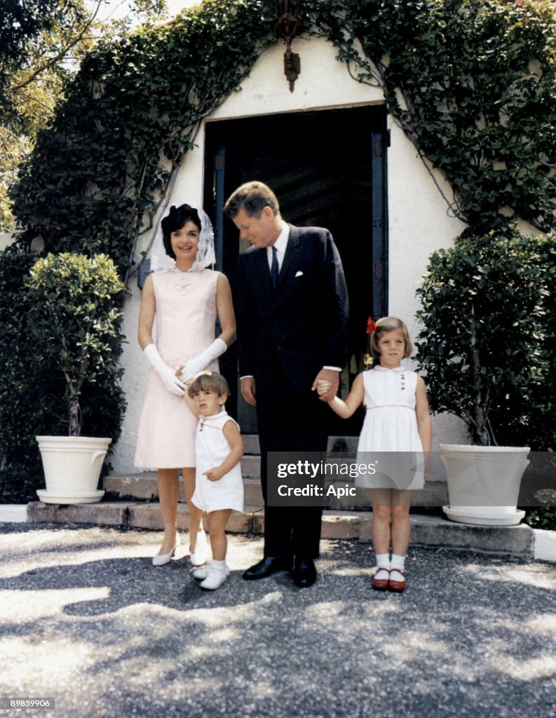 President John Kennedy and his wife Jackie and their children John Jr and Caroline at Palm Beach, Florida april 14, 1963 (Jackie wearing a mauve linen dress by Oleg Cassini created in 1963)