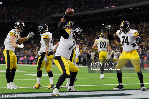 Marcus Gilbert of the Pittsburgh Steelers spikes the football after a touchdown by Roosevelt Nix in the second quarter against the Houston Texans at...
