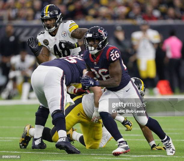 Lamar Miller of the Houston Texans rushes with the ball against the Pittsburgh Steelers at NRG Stadium on December 25, 2017 in Houston, Texas.