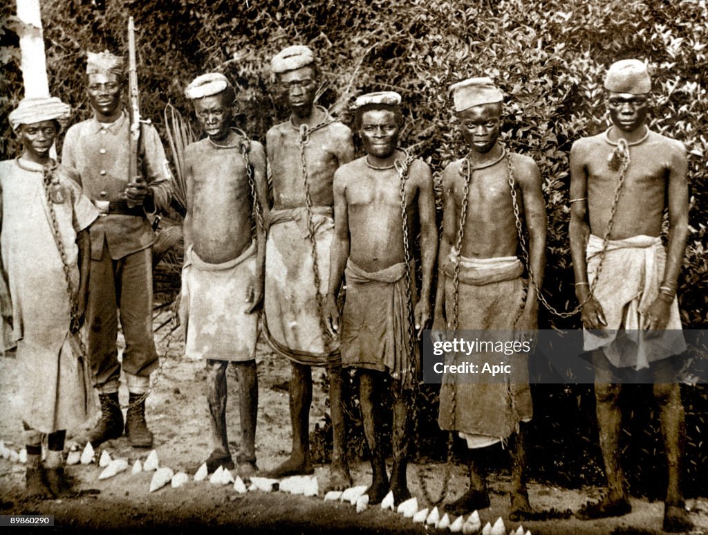 Chained convicts under police guard in Zanzibar, Tanzania c. 1880