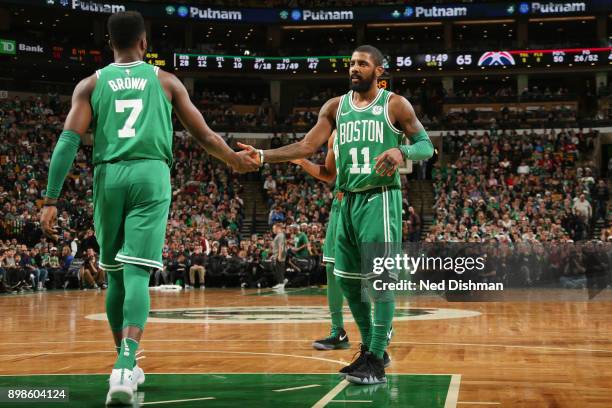 Jaylen Brown of the Boston Celtics and Kyrie Irving of the Boston Celtics share a handshake during the game against the Washington Wizards on...