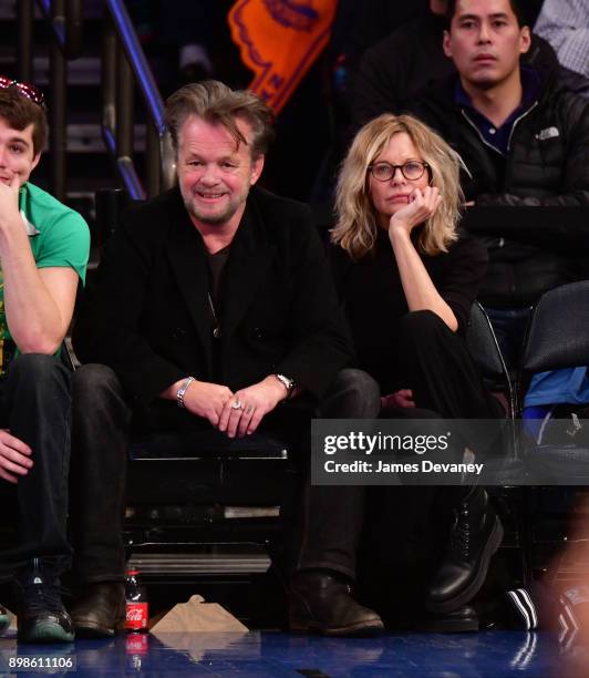 John Mellencamp and Meg Ryan attend the New York Knicks Vs Philadelphia 76ers game at Madison Square Garden on December 25, 2017 in New York City.