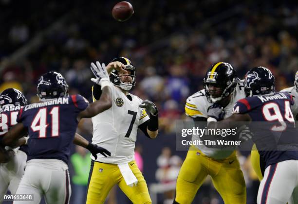 Ben Roethlisberger of the Pittsburgh Steelers throws a pass in the third quarter under pressure by Zach Cunningham of the Houston Texans at NRG...