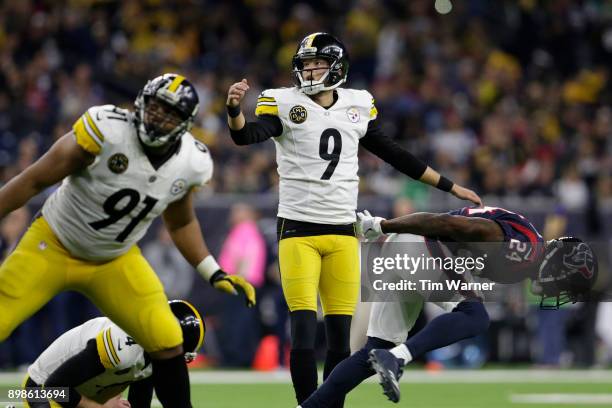 Chris Boswell of the Pittsburgh Steelers reacts after an extra point defended by Johnathan Joseph of the Houston Texans in the third quarter at NRG...