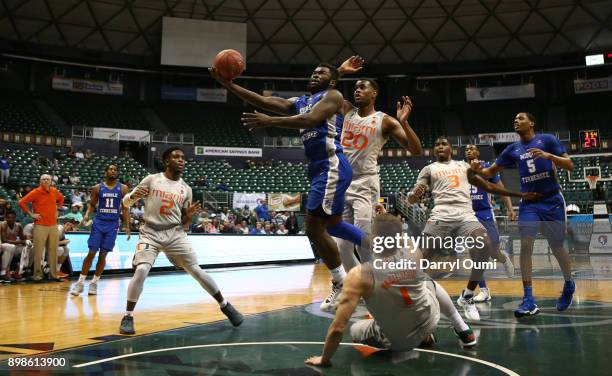 Giddy Potts of the Middle Tennessee Blue Raiders drives to the basket during the first half of the 3rd place game of the Diamond Head Classic against...