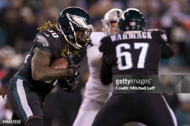 Jay Ajayi of the Philadelphia Eagles runs the ball in the first quarter as Chance Warmack blocks against the Oakland Raiders at Lincoln Financial...