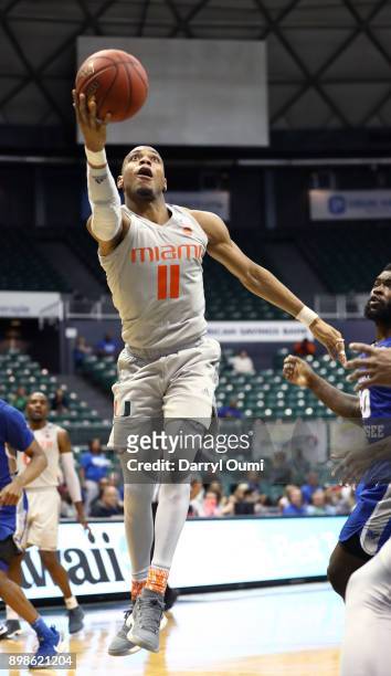 Bruce Brown Jr. #11 of the Miami Hurricanes glides to the basket and takes a shot during the second half of the 3rd place game of the Diamond Head...