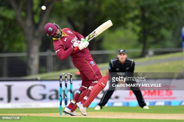 West Indies batsman Chris Gayle is hit by a ball during the third one-day international cricket match between New Zealand and the West Indies at...