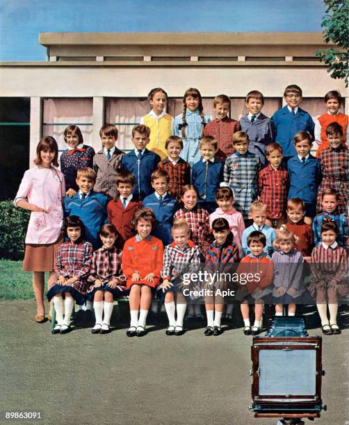 French advert for the coat for schoolchild, Blousenyl Nylfrance, illustrating by a photography of a class, extracting from the news magazine Paris...