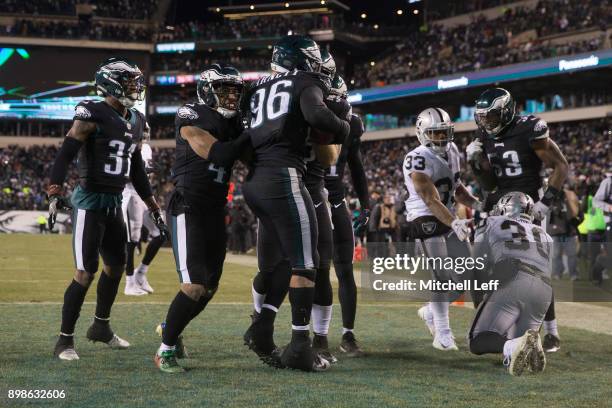 Derek Barnett of the Philadelphia Eagles celebrates with Jalen Mills, Ronald Darby, and Nigel Bradham in front DeAndre Washington and Jalen Richard...