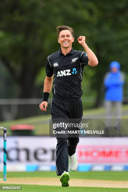 New Zealand's Trent Boult celebrates bowling out West Indies batsman Jason Mohammed during the third one-day international cricket match between New...