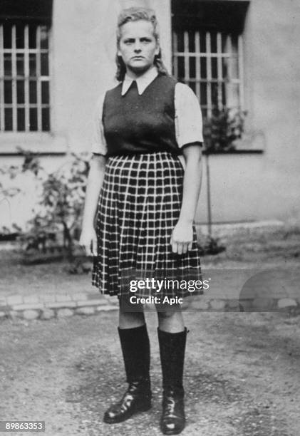 Irma Grese , called the dog of Auschwitz, standing in the courtyard of the Prisoner of War cage at Celle, awaiting trial, August 1945; she supervised...