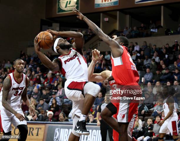Ike Nwamu of the Sioux Falls Skyforce drives to the basket against Durand Scott of the Memphis Hustle during an NBA G-League game on December 25,...